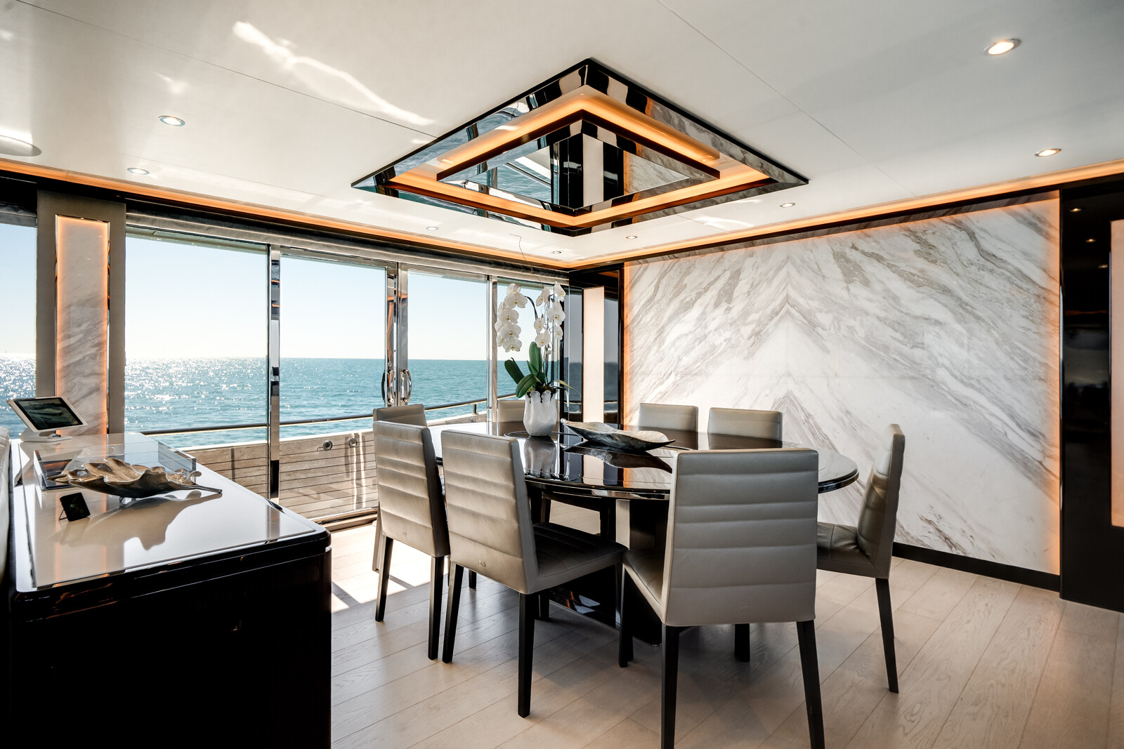 Formal dining area for ten guests aboard DREAMS Ocean Alexander 120