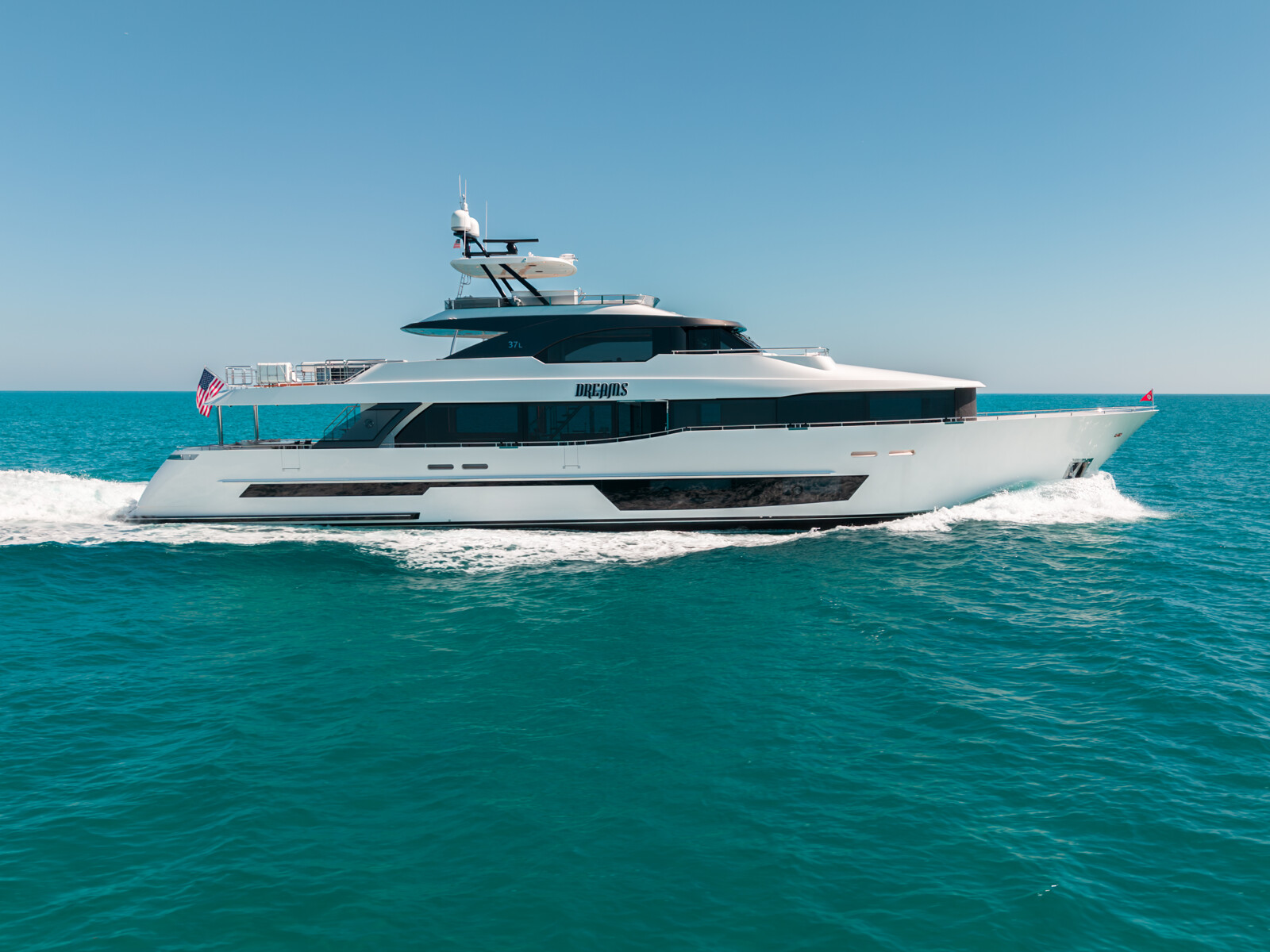 DREAMS 120' Ocean Alexander motor yacht for sale, underway flying the US flag